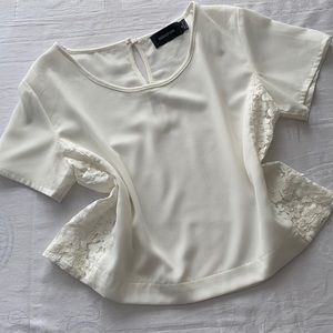 Minkpink ivory back button blouse. Boxy fit. Lace side panels. Size Medium.